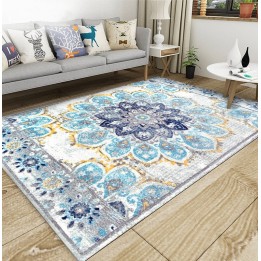 Tapis sol motif traditionnel aspect ancien, couleur avec les différentes nuances de bleu, gris claire et jaune