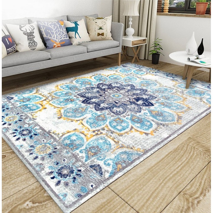 Tapis sol motif traditionnel aspect ancien, couleur avec les différentes nuances de bleu, gris claire et jaune