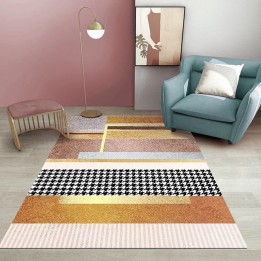 Tapis doré ton orange inspiré de la haute couture, motif pied-de-poule intégré