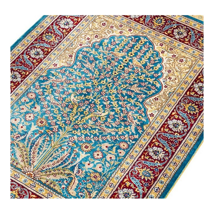 Tapis d'orient traditionnel en soie noué à la main motif fleurs et oiseaux.