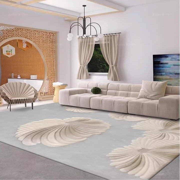 Tapis salle de réception en laine de Nouvelle-Zélande fait main, coquillages en relief sur fond gris claire.