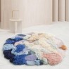 Tapis rond salle d'attente couleur bleu, saumon, rose pastel.