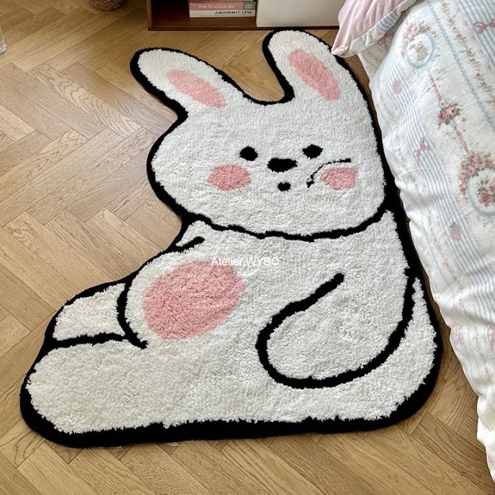 Descente de lit charmant tapis gros lapin curieux.
